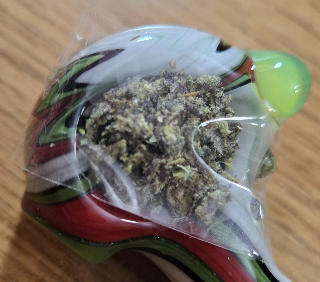 Make sure the non-sticky portion of tape is facing downwards and touching the flower.