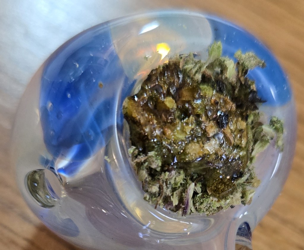 Melted hash atop a packed bowl