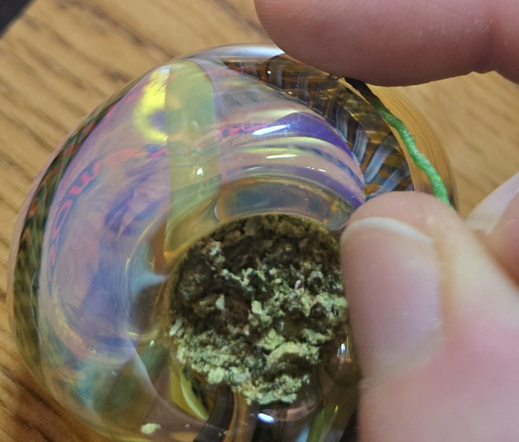 Stamp the ember against the glass bowl!